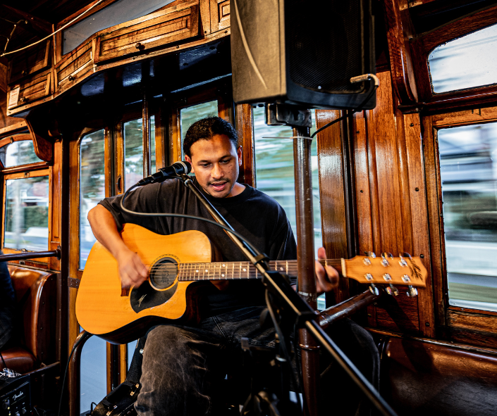 Toli performing on board the Groove Tram