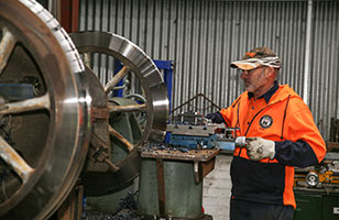 Refurbishing the wheels of a heritage tram at the Bendigo Tramways Workshop