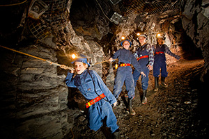 Family underground exploring the hidden tunnels of Central Deborah Gold Mine in Bendigo